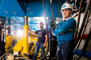  » From left: PhD student Greg Congdon and Andreas Stavridis, associate professor in the Department of Civil, Structural and Environmental Engineering, stand under the shake table in the Structural and Earthquake Engineering Simulation Laboratory 