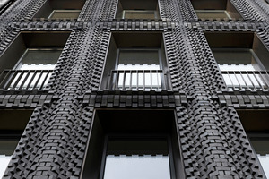  » The patterns visible across the surface are informed, in part, by the interactions between materials and structure. The bricks appear to lap up against glazing, swell and bow between floors and are inset frame-like to denote the building’s perimeter  