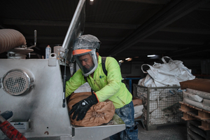  » Didienson putting raw materials into the batch container 
