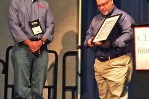  »7 John Sanders (right) presented Robert Maner, J.C. Steele &amp; Sons, with the 2015 “The Harold B. Newman best speaker award” 