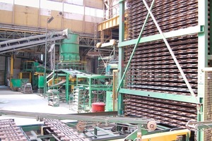  »4 Shaping equipment at the Jamina plant with circular screen feeder, extruder and roofing tile press, dryer car unloading can be seen at the right front 