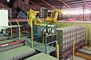  »9 The dried bricks are set onto the tunnel kiln cars by two robots 