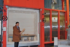  »7 Eric Giradot standing in front of one of the testing kilns 