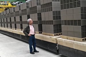  »1 Belkacem Ghezel , Ceratec’s Agent in Algeria, inspects the first dried hollow bricks set and ready for firing 