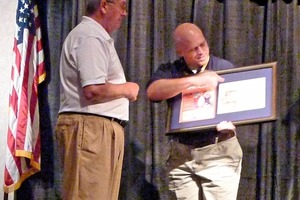  »1 John Sanders paid tribute to the achievements of Denis Brosnan (left)  